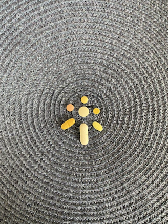 A close-up of various prescription medicines neatly arranged on a pharmacy counter.