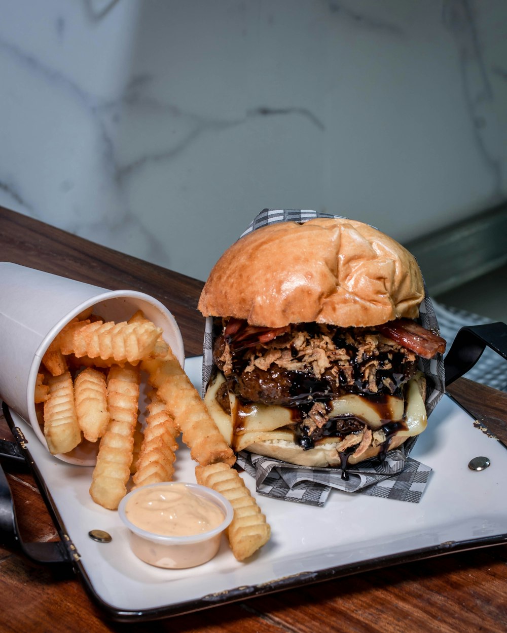 burger with fries on plate