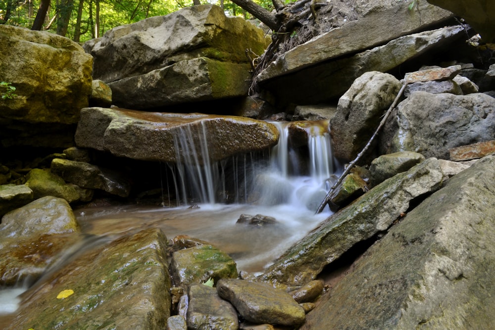 water falls on rocky mountain