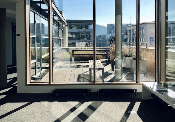 white and brown wooden framed glass window