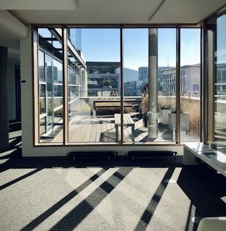 white and brown wooden framed glass window