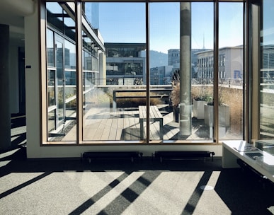 white and brown wooden framed glass window