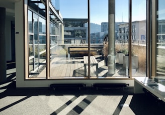 white and brown wooden framed glass window