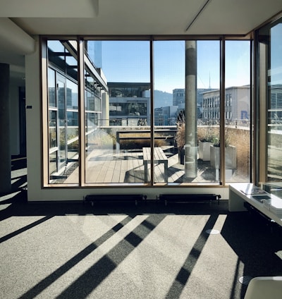 white and brown wooden framed glass window