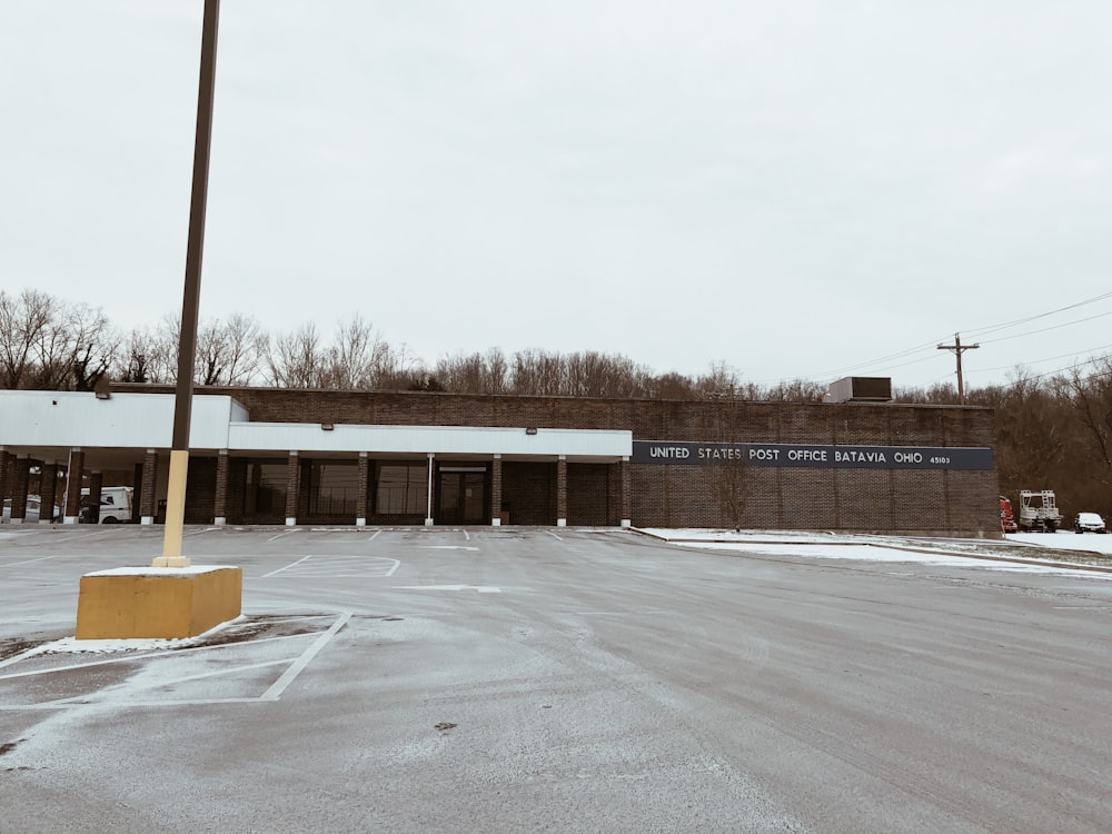 gray concrete road near brown building during daytime