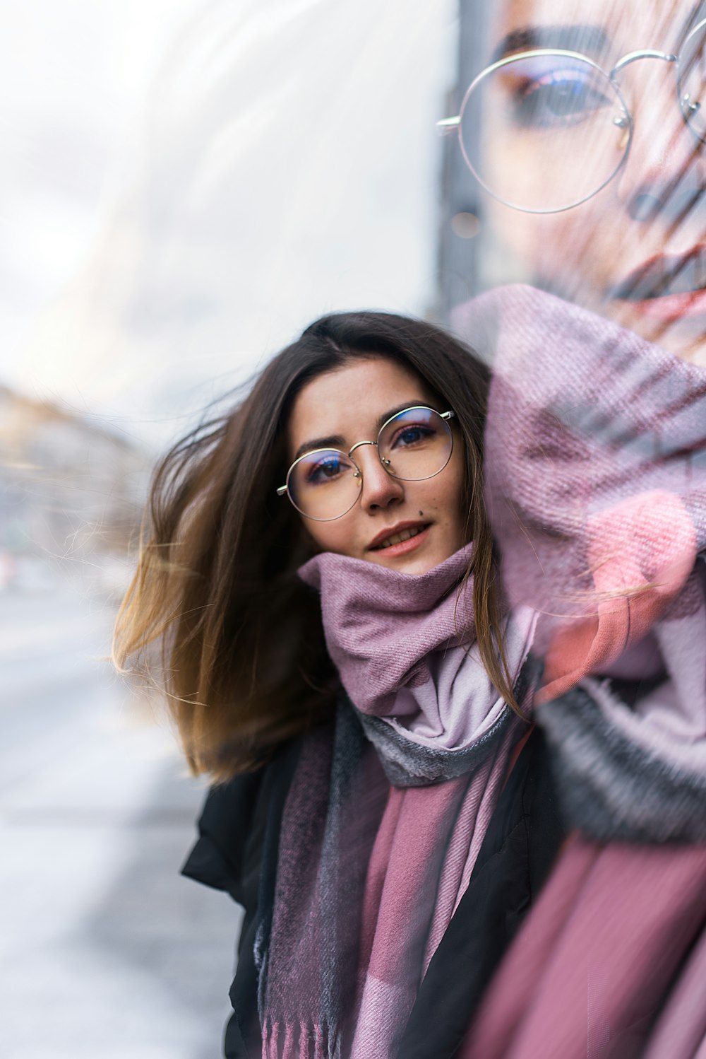 woman in black framed eyeglasses and gray scarf