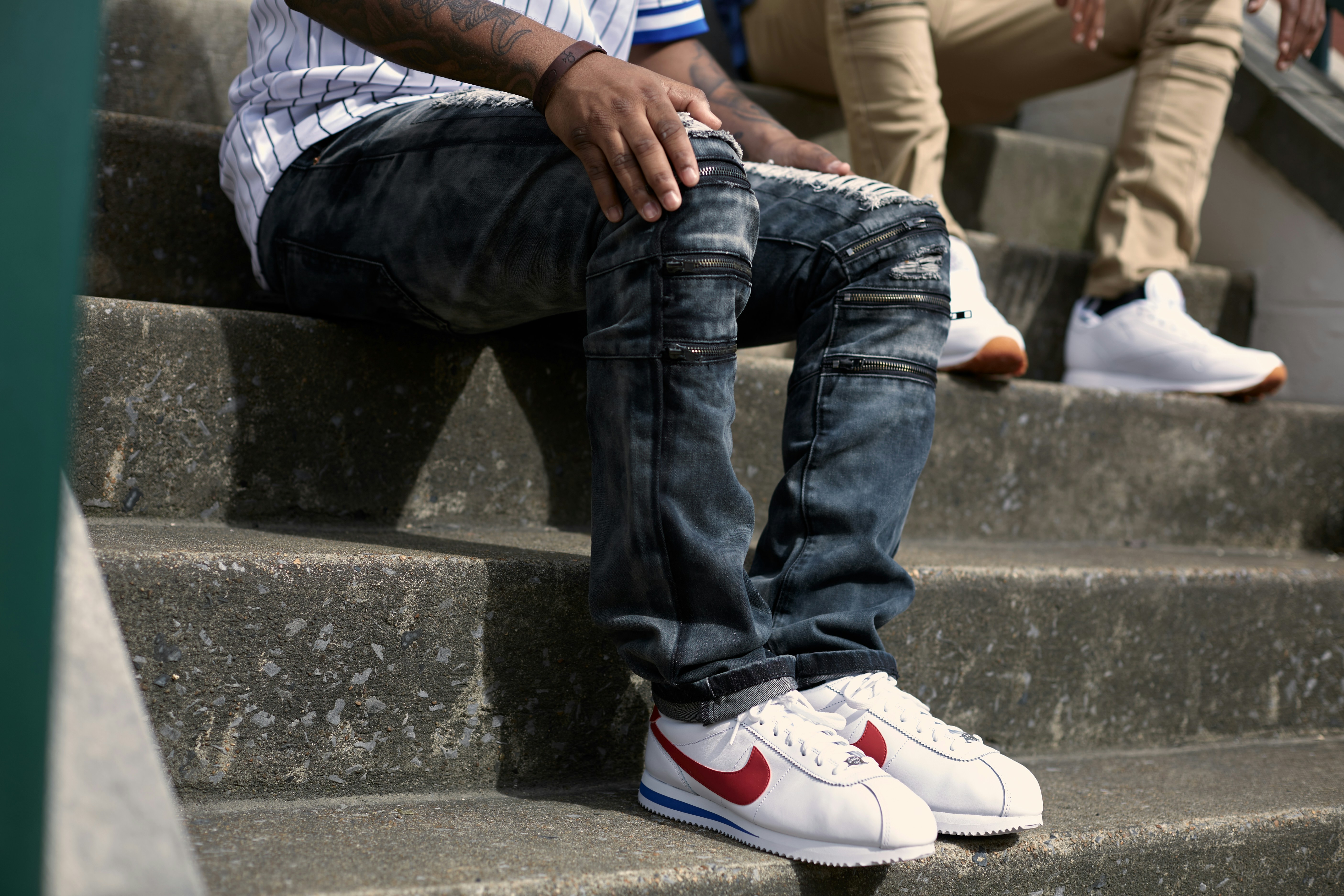 person in blue denim jeans and white 