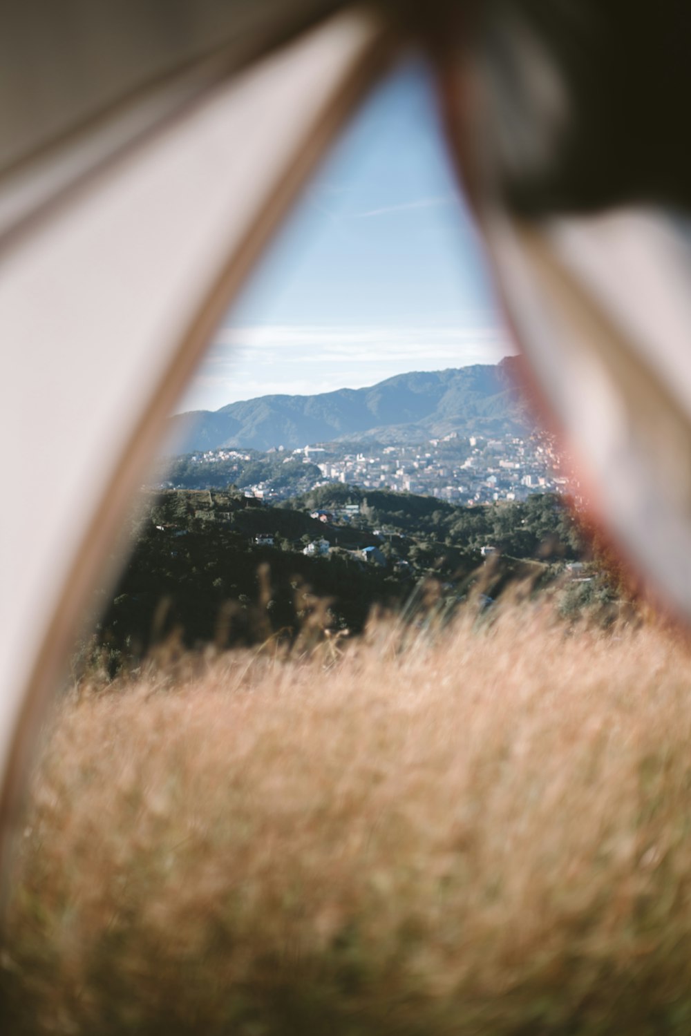 brown grass field near mountain during daytime