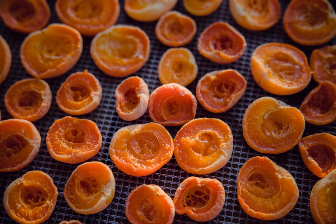 orange fruits on brown wooden table