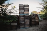 A stack of wooden crates ready for timely export, highlighting ethical sourcing.