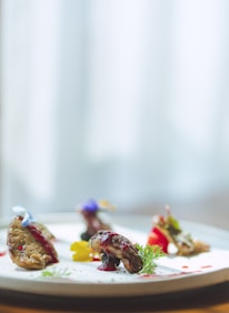A beautifully arranged plate of gourmet food showcasing culinary artistry.