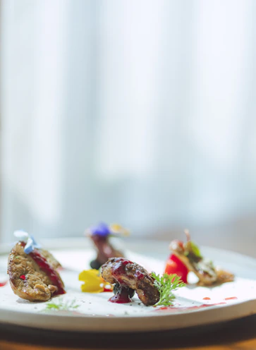 Close-up of artisan-prepared flavorful dishes plated with artistic flair.