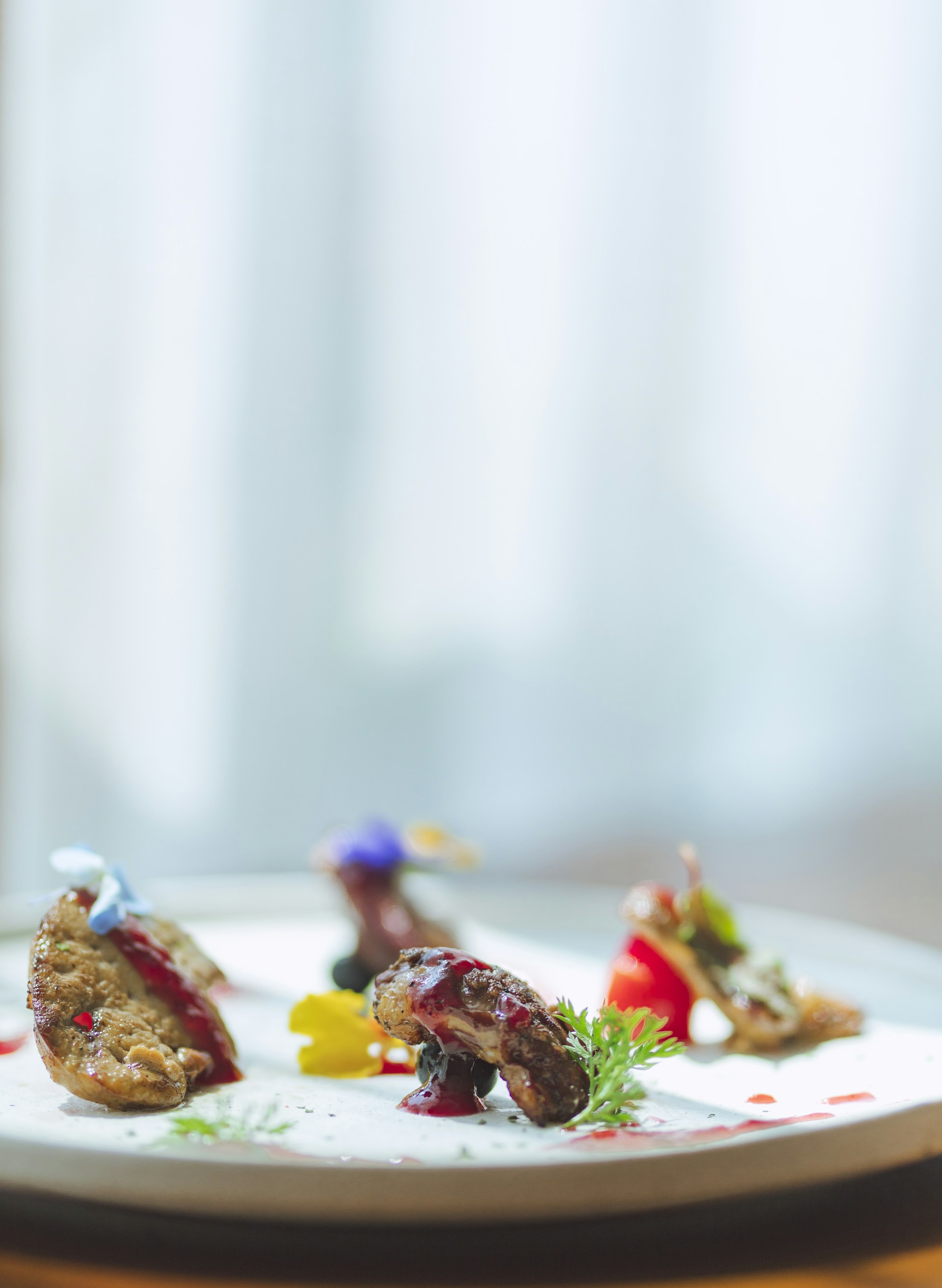 A close-up of a beautifully plated signature dish, showcasing fresh ingredients and artistic presentation.