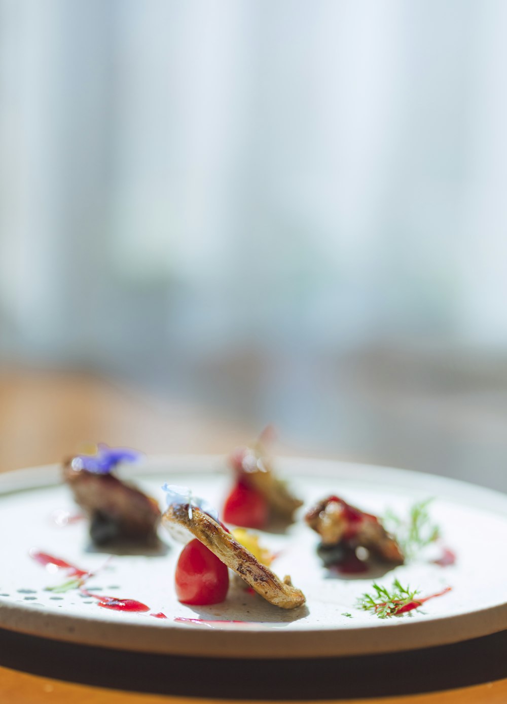 red and brown food on white ceramic plate