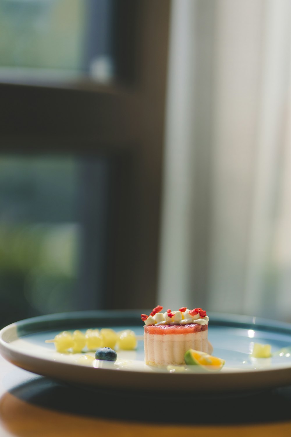 yellow and orange candies on white ceramic plate