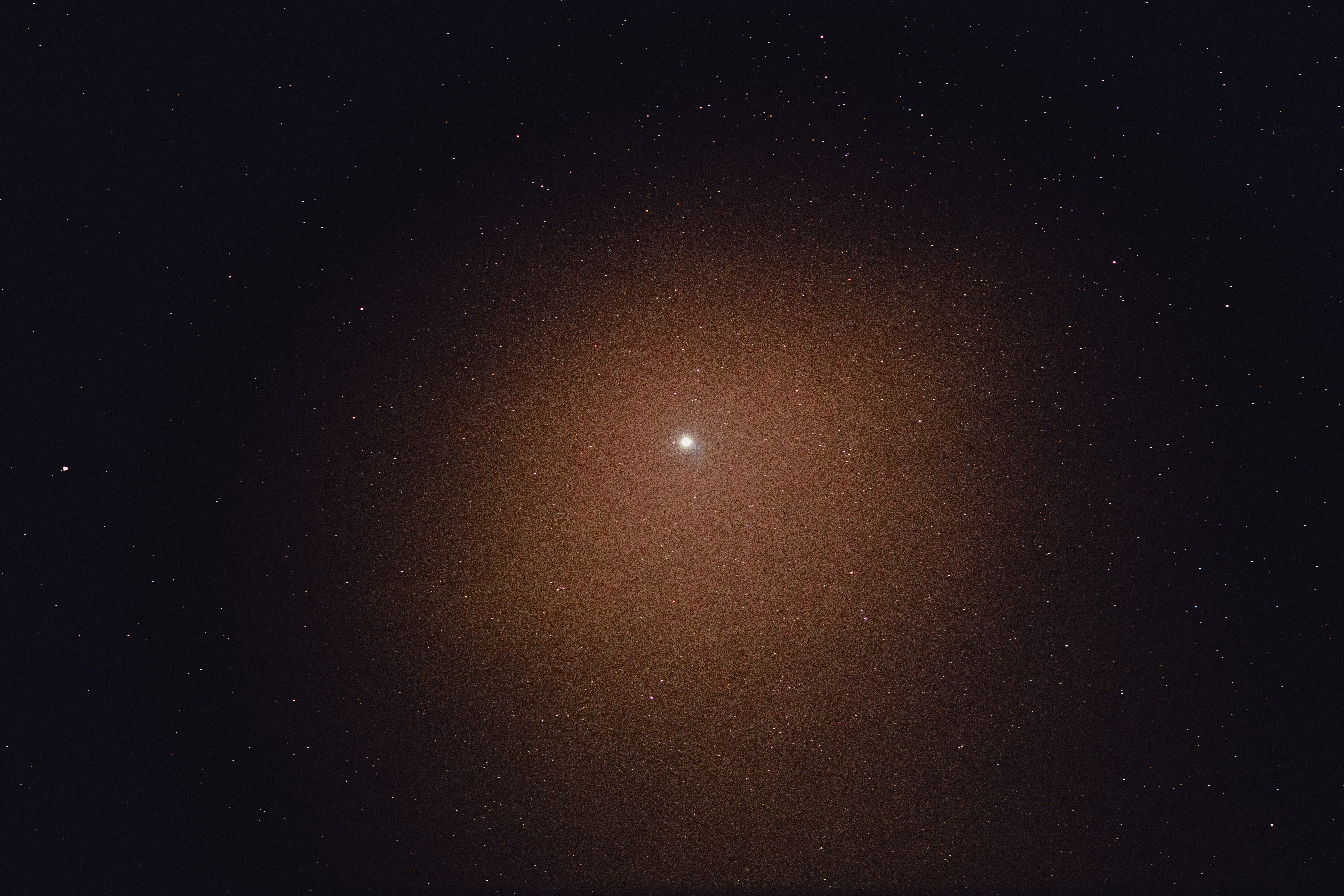 orange and yellow sun in dark sky