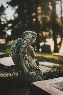 gray concrete statue of a woman