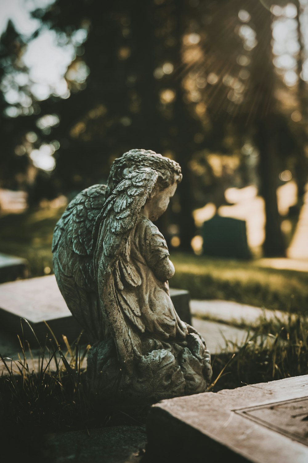 gray concrete statue of a woman