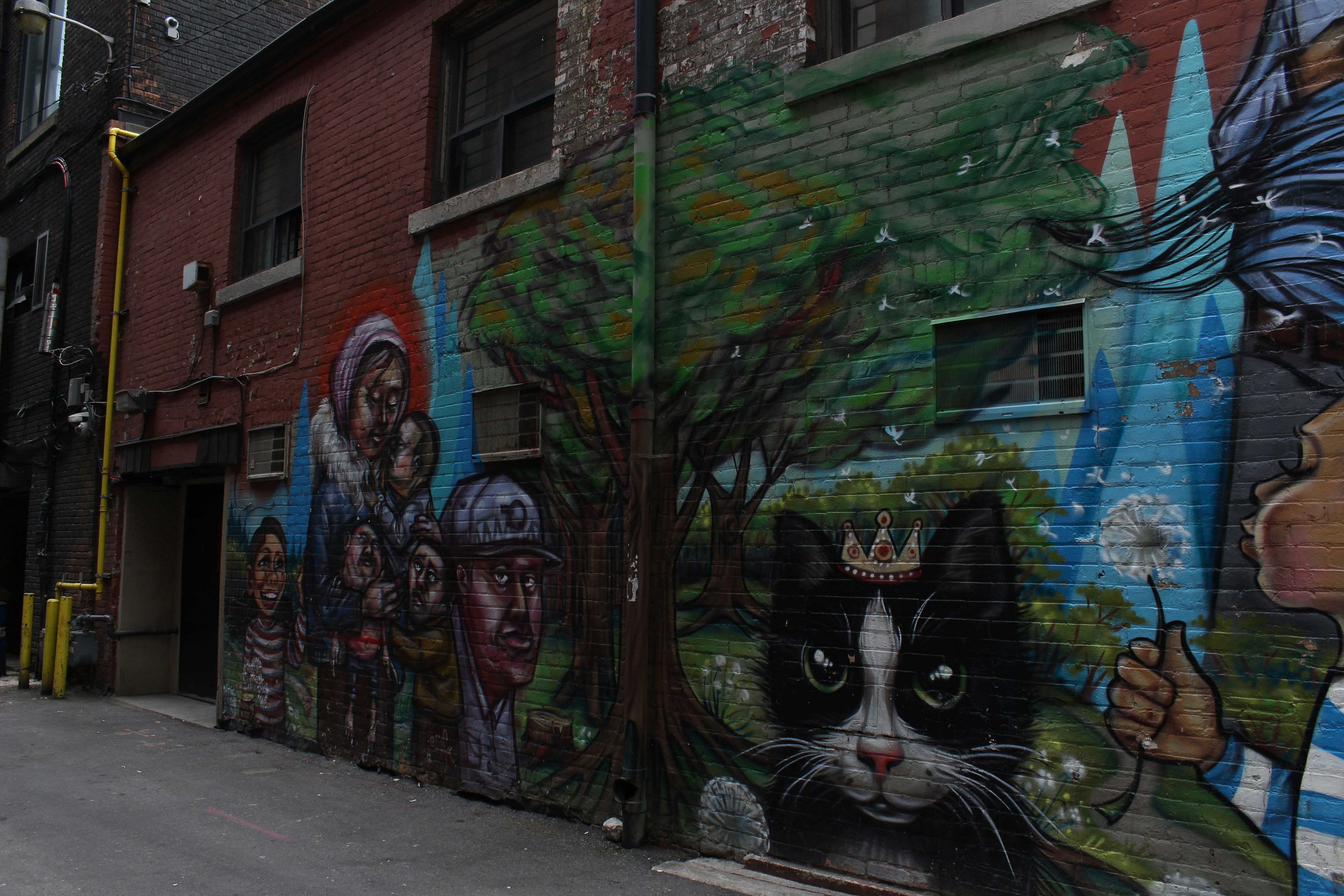 graffiti on brown brick building