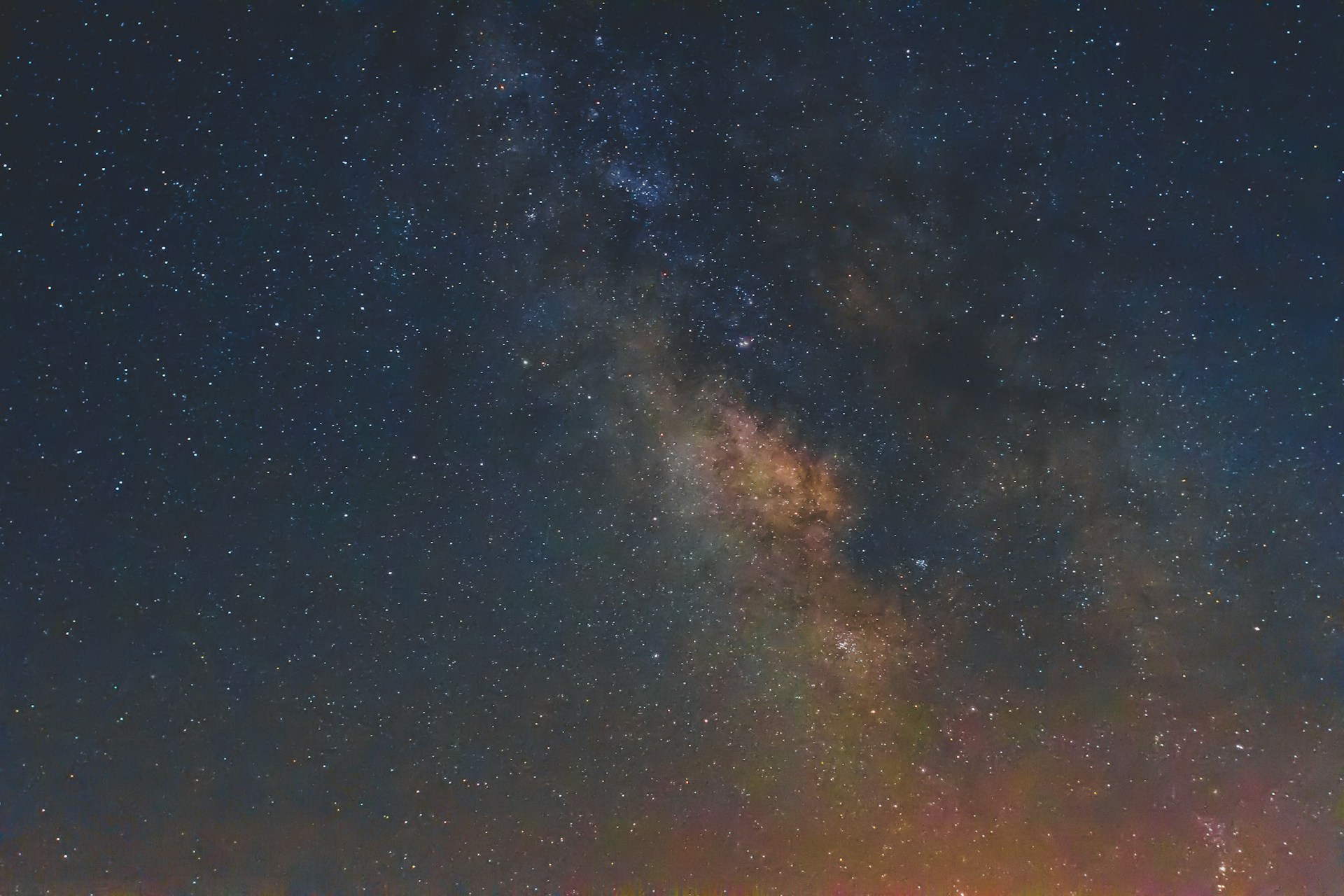 A breathtaking view of a distant galaxy filled with vibrant stars and swirling nebulae.