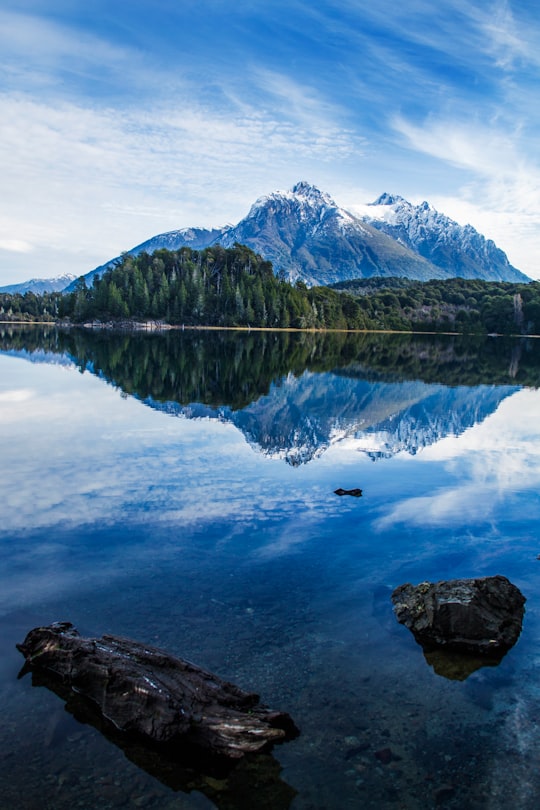 lake near mountain under blue sky during daytime in Parque Nacional Nahuel Huapi Argentina