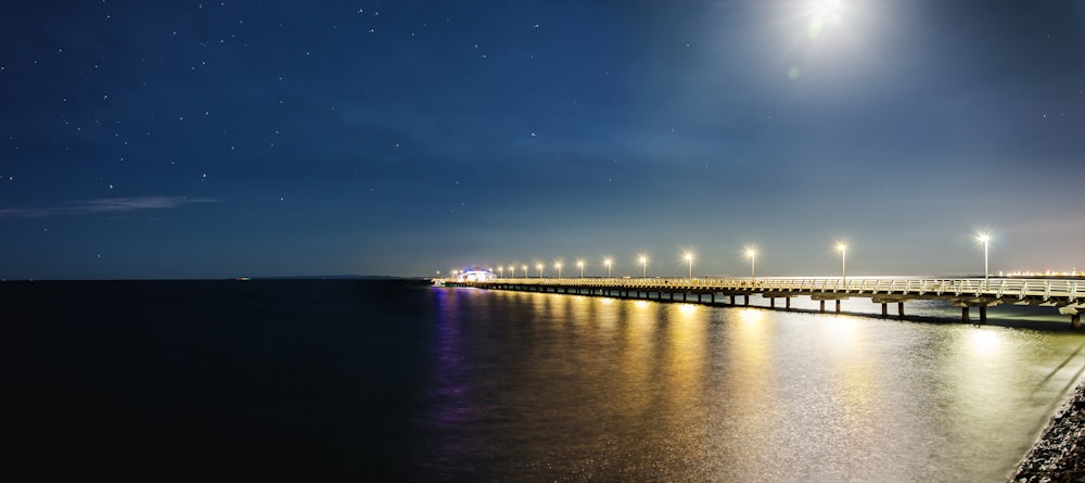 bridge over water during night time