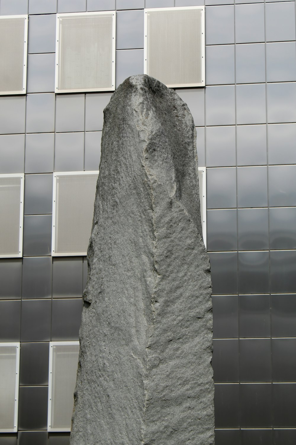 gray stone near white metal frame