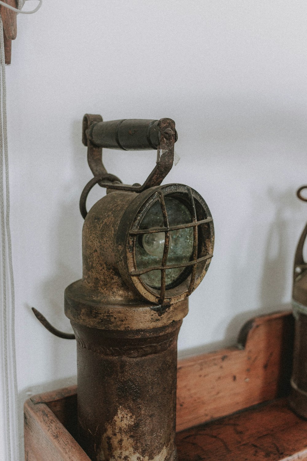 black metal bell on brown wooden table