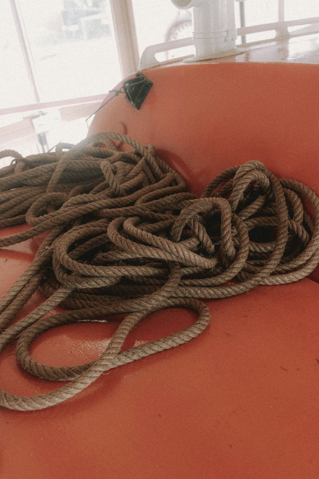 brown rope on red table