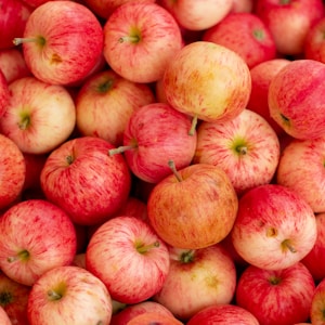 red apples on brown wooden table