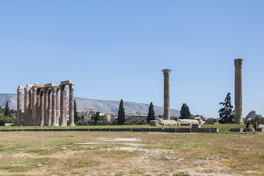 brown concrete building under blue sky during daytime in Hadrian's Arch Greece