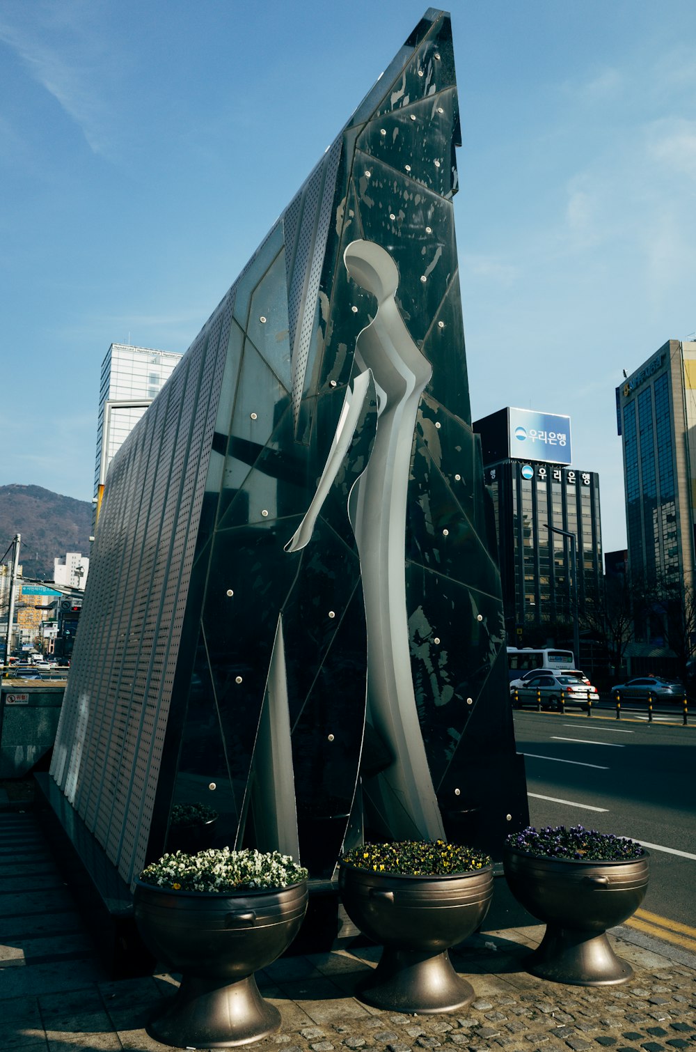 gray glass building near road during daytime