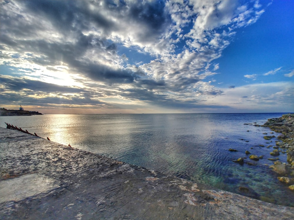 blue sky over sea and white clouds during daytime