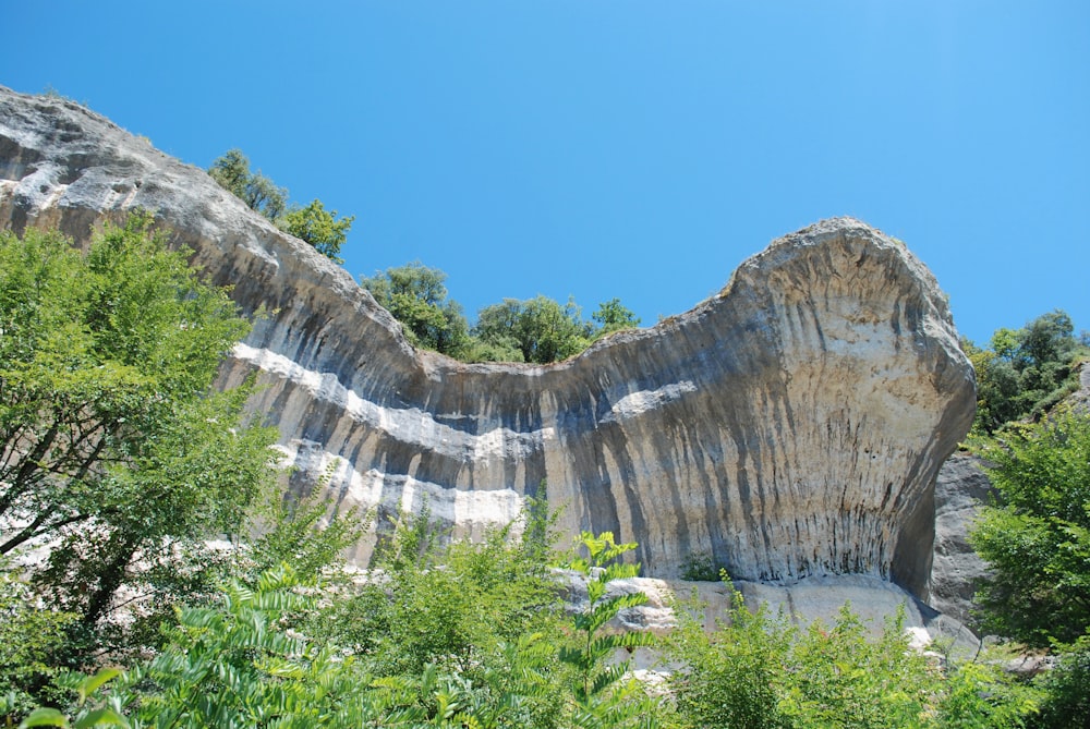 brown rocky mountain under blue sky during daytime