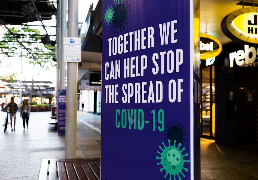 a sign that says together we can help stop the spread of covid - 19