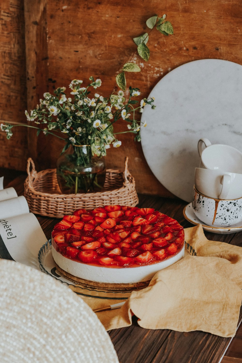 red round fruits on white ceramic bowl
