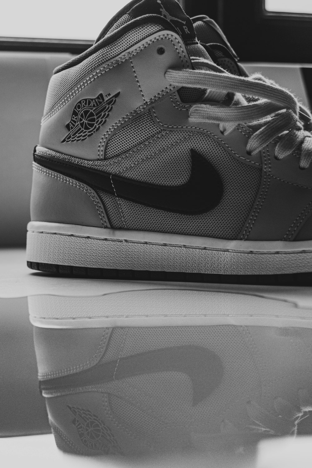 person in gray denim jeans and black and white nike sneakers photo – Free  Grey Image on Unsplash