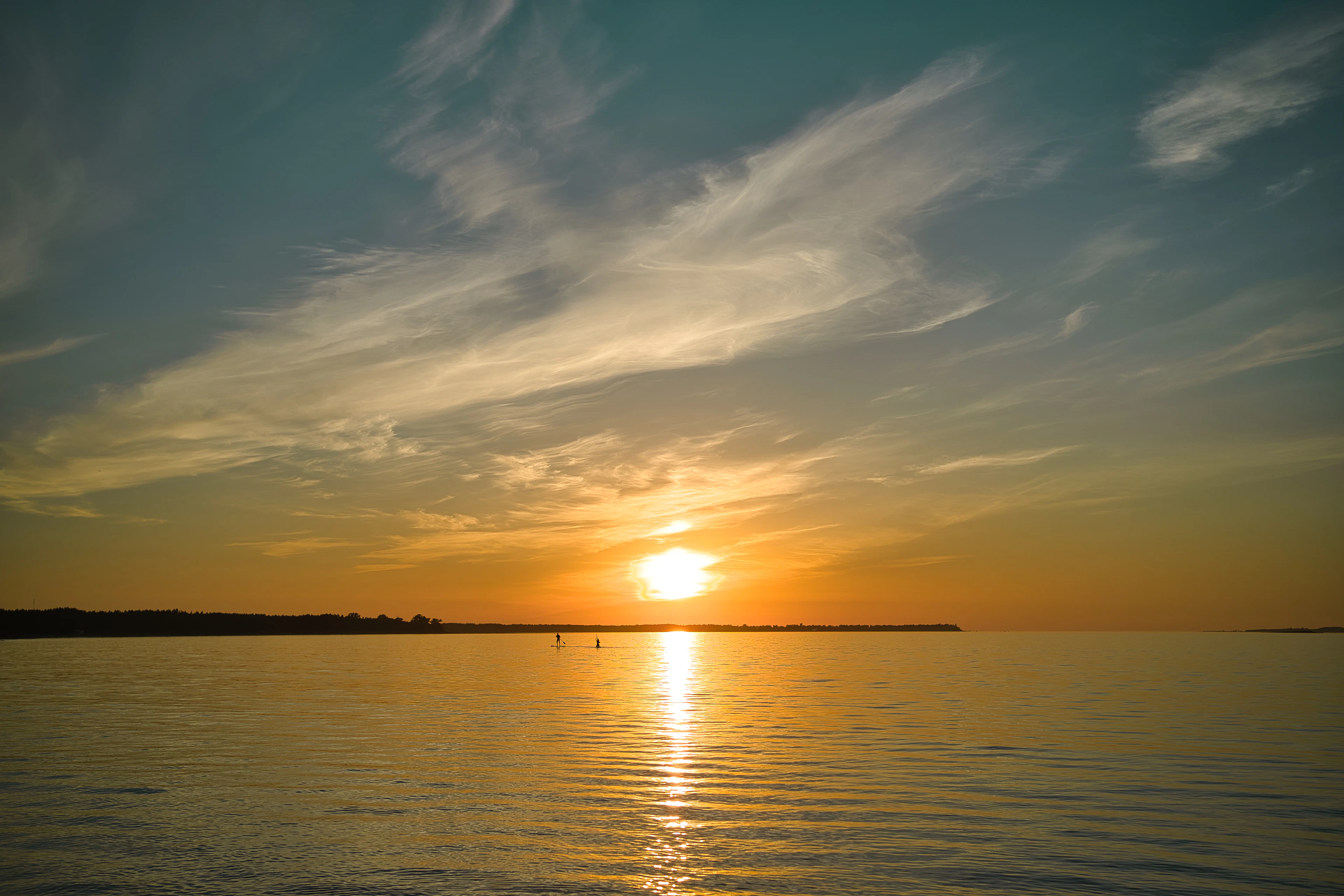 Sunset over the Baltic Sea — still water and wide sky