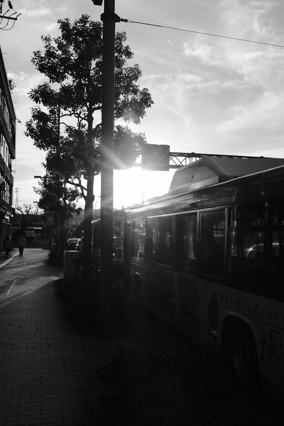 grayscale photo of bus on road