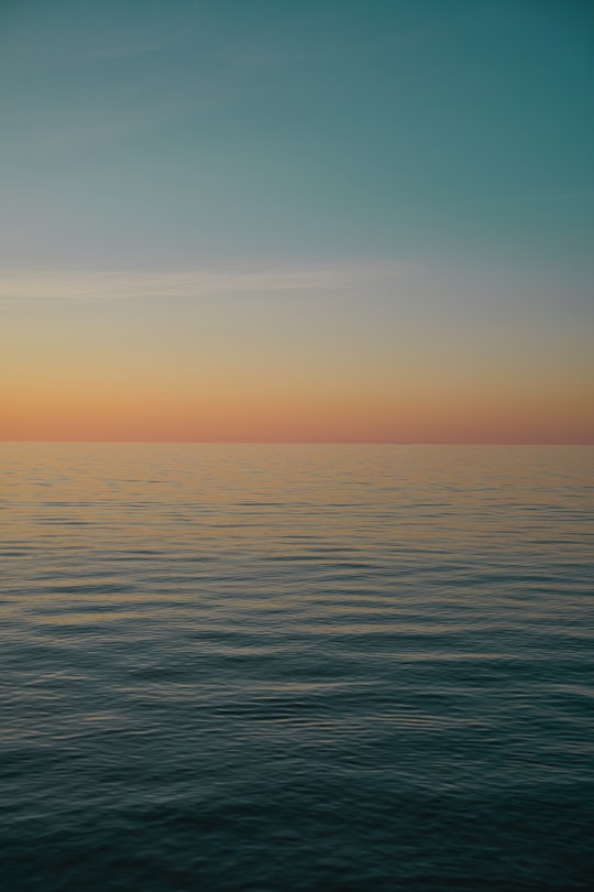 body of water during sunset in Valkla Estonia