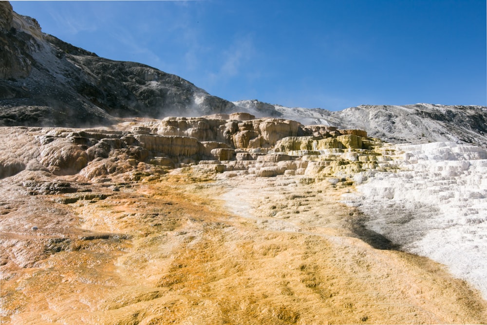 gray rocky mountain under blue sky during daytime