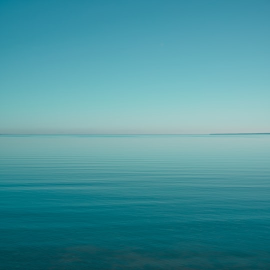 blue ocean water under blue sky during daytime in Valkla Estonia