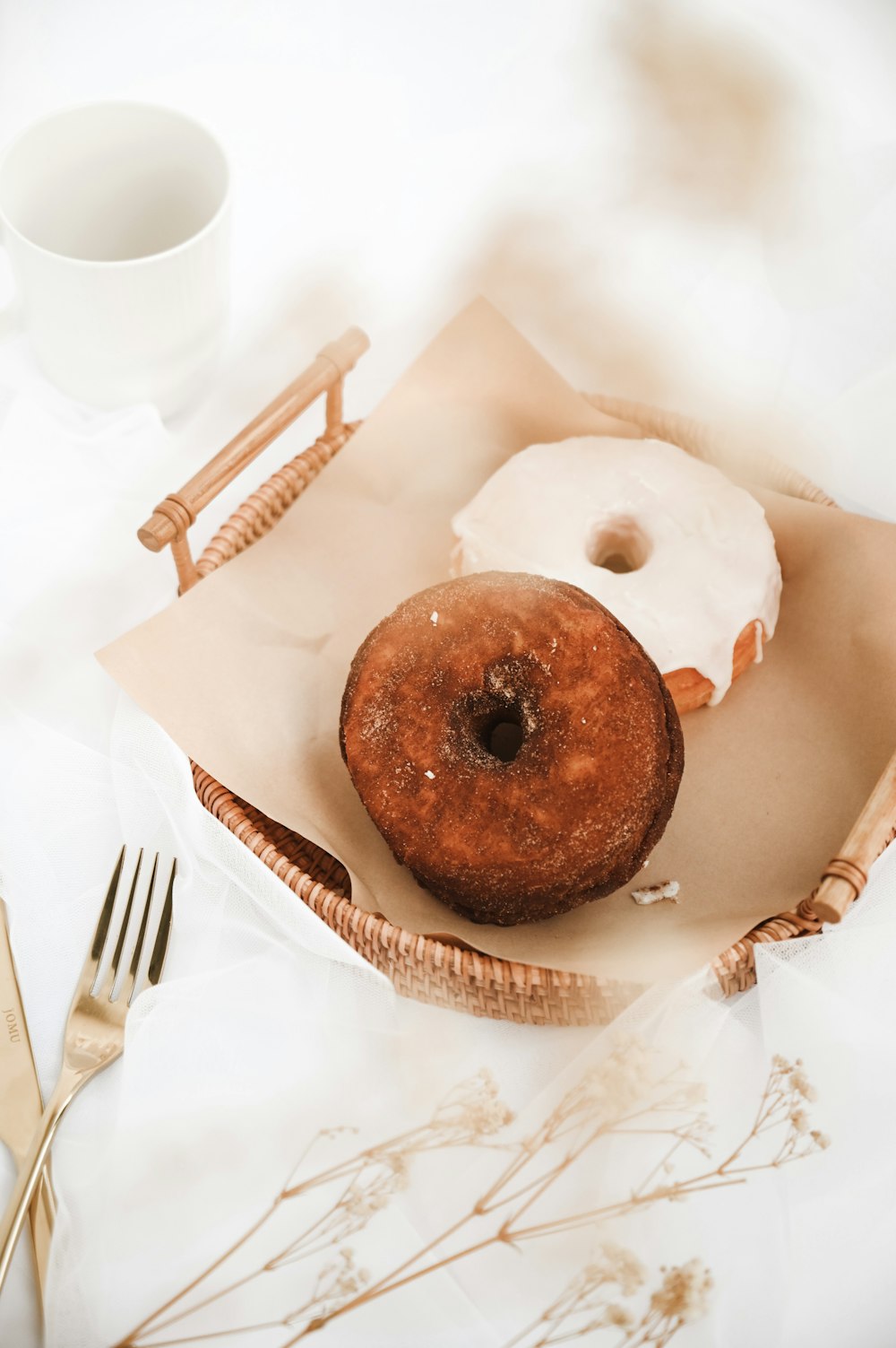 brown doughnut on white paper