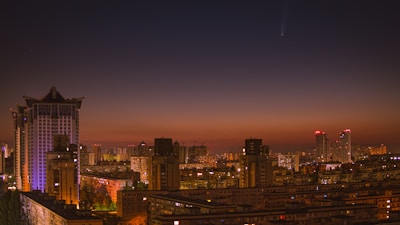 A city skyline at sunset, representing the markets Comet Investments serves.