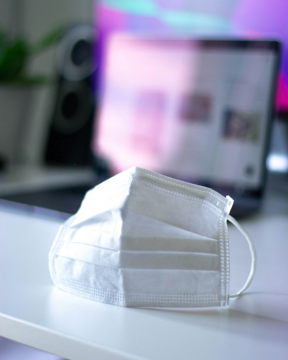 white leather pouch on white table