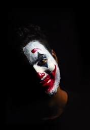 person with red and white face paint