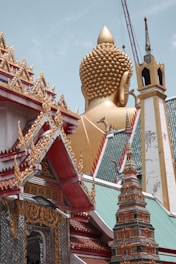 gold and red temple under blue sky during daytime