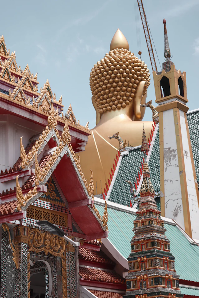 tantra massage in Bangkok — gold temple under a blue sky