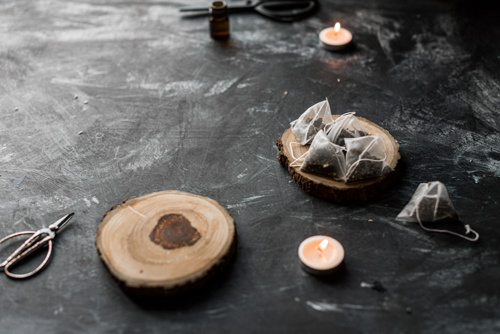 brown wooden round ornament on black wooden table