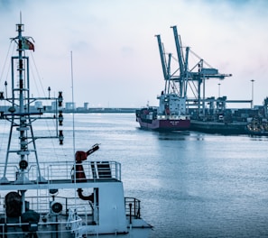 red and white ship on sea during daytime